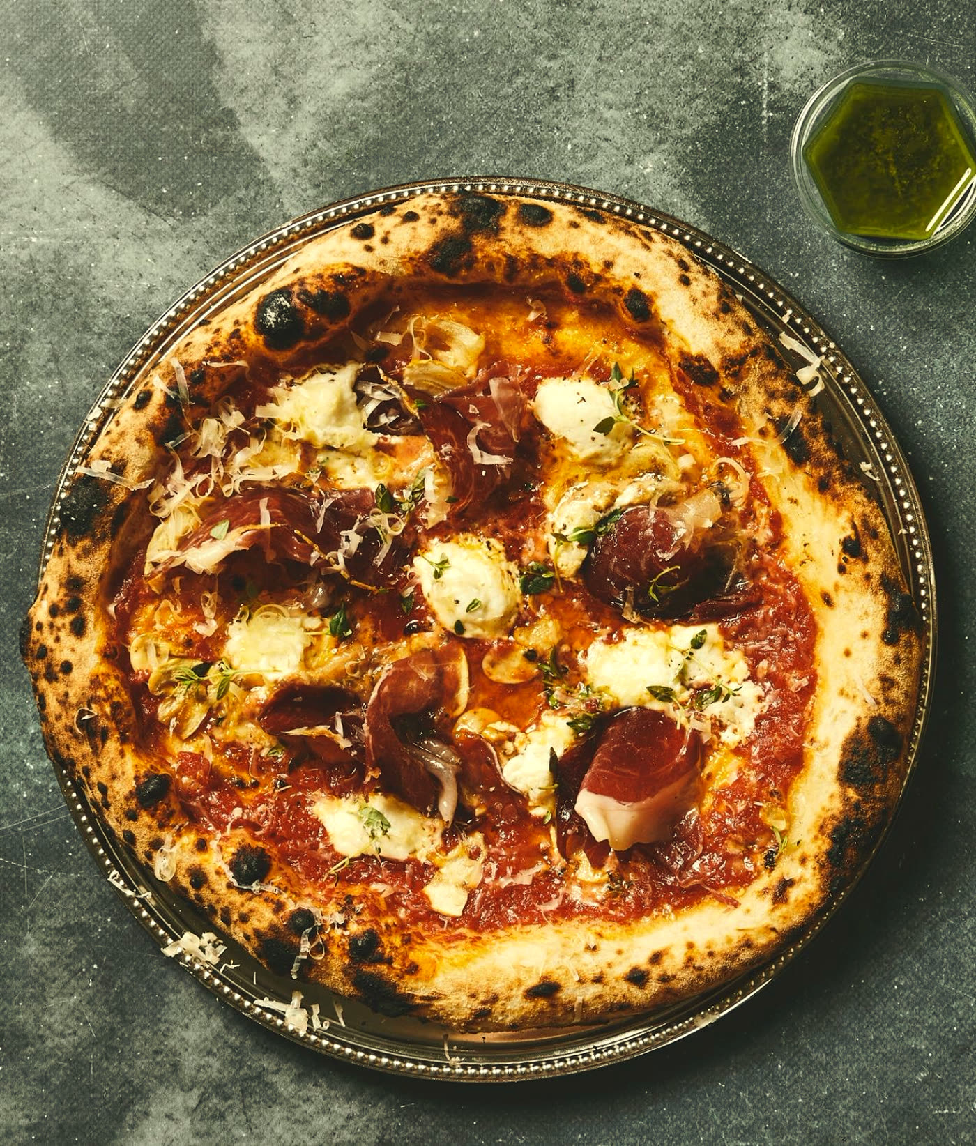 Wood-fired pizza with bresaola and ricotta