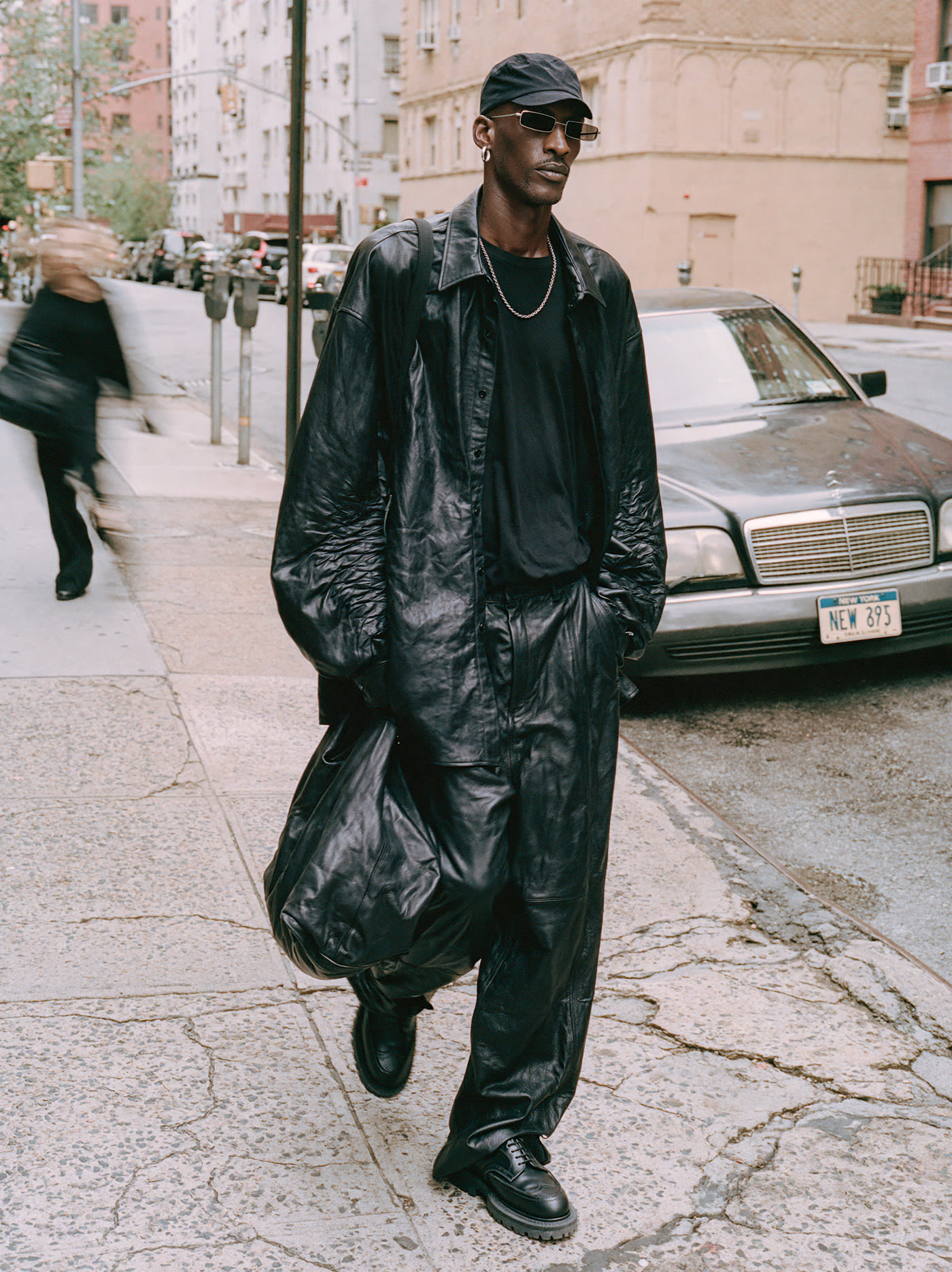Candid street style, leather-clad man in NYC